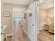 Inviting hallway featuring hardwood floors, a stylish sliding door, and serene ocean views at 4325 Gulf Of Mexico Dr # 204, Longboat Key, FL 34228