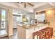 Bright kitchen with granite countertops, center island, stainless appliances and ample cabinet space at 4325 Gulf Of Mexico Dr # 204, Longboat Key, FL 34228