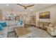 Open-concept living room with a neutral color palette, ceiling fan, and seamless connection to the kitchen at 4325 Gulf Of Mexico Dr # 204, Longboat Key, FL 34228