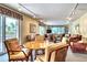 Cozy living area with comfortable seating, bright lighting and ocean views through sliding glass doors at 4325 Gulf Of Mexico Dr # 204, Longboat Key, FL 34228