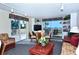 Inviting living room with ocean views, comfortable seating and an open floorplan with access to balcony at 4325 Gulf Of Mexico Dr # 204, Longboat Key, FL 34228