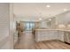 Open-concept living space featuring a modern kitchen, dining area, and comfortable seating at 4325 Gulf Of Mexico Dr # 204, Longboat Key, FL 34228