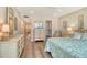 Bedroom with bed, dressers, ceiling fan, and a closet with sliding doors at 4325 Gulf Of Mexico Dr # 204, Longboat Key, FL 34228