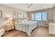 Light and airy bedroom features a ceiling fan and a large window with views of the ocean at 4325 Gulf Of Mexico Dr # 204, Longboat Key, FL 34228