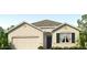 Beautiful single-story home showcasing a welcoming front entrance, two-car garage, and well-manicured landscaping at 4327 112Th E St, Palmetto, FL 34221