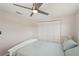 Bright bedroom boasts a large closet with white louvered doors and a full sized bed at 4330 Alligator Dr, Venice, FL 34293
