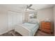 Comfortable bedroom featuring a bed, closet, ceiling fan, and dresser at 4330 Alligator Dr, Venice, FL 34293