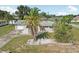 Exterior of home with driveway, landscaping, and a well-maintained lawn at 4330 Alligator Dr, Venice, FL 34293