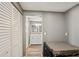 Hallway leading to the bathroom featuring double sinks and natural light at 4330 Alligator Dr, Venice, FL 34293