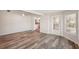 Open-concept living room with wood floors, a ceiling fan, and access to the kitchen at 4330 Alligator Dr, Venice, FL 34293