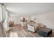 Spacious living room combines dining and seating areas with updated flooring at 4330 Alligator Dr, Venice, FL 34293