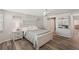 Bright bedroom with new floors, a ceiling fan, and an attached closet at 4330 Alligator Dr, Venice, FL 34293