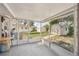 Screened patio featuring a cement floor and access to the backyard and shed at 4330 Alligator Dr, Venice, FL 34293