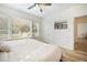 Bright bedroom featuring hardwood floors, closet storage, and natural light from a large window at 520 27Th W St, Bradenton, FL 34205