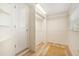 Walk-in closet with ample hanging space and shelving, providing organized storage solutions at 520 27Th W St, Bradenton, FL 34205