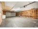 Spacious garage with painted walls, concrete floor, storage cabinet, and garage door at 520 27Th W St, Bradenton, FL 34205