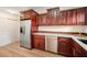 Updated kitchen features stainless steel appliances, granite countertops, and dark wood cabinetry at 520 27Th W St, Bradenton, FL 34205