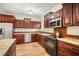 Updated kitchen featuring stainless steel appliances, granite countertops, and stylish wood cabinets at 520 27Th W St, Bradenton, FL 34205