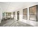 Enclosed porch with seating area, ceiling detail and windows at 520 27Th W St, Bradenton, FL 34205