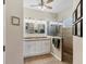 Bathroom area with double vanity sinks, natural tile, and glass shower stall at 5333 Tide Point Way, Bradenton, FL 34208