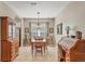 Traditional dining room with wooden furniture set and adjacent to office space at 5333 Tide Point Way, Bradenton, FL 34208