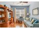 Comfortable living room with hardwood floors, furniture, ceiling fan, and bright, natural light at 5333 Tide Point Way, Bradenton, FL 34208