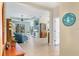 Open-concept living room with tile floors, sliding glass doors, comfortable seating, and ample natural light at 5333 Tide Point Way, Bradenton, FL 34208