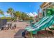 Outdoor playground features a blue slide, picnic table, and secure fencing for community enjoyment at 5333 Tide Point Way, Bradenton, FL 34208