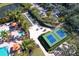 Aerial view of the community amenities including the pool, spa, bocce ball, and pickleball courts at 5863 Cavano Dr, Sarasota, FL 34231
