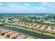 An aerial view of the community showcasing the homes, lakes, and surrounding cityscape at 5863 Cavano Dr, Sarasota, FL 34231