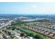 Beautiful aerial view of the community featuring lakes, tree lined streets, and Sarasota Bay in the distance at 5863 Cavano Dr, Sarasota, FL 34231