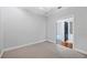Bedroom with carpeted floors, ceiling fan, and doorway to the ensuite bath and shower at 5863 Cavano Dr, Sarasota, FL 34231