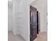 Walk-in closet with metal shelving units and carpeted floors providing storage space at 5863 Cavano Dr, Sarasota, FL 34231