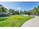 A well-maintained dog park with plenty of green space, a shaded gazebo, and benches at 5863 Cavano Dr, Sarasota, FL 34231