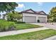Charming single-Gathering home with a two-car garage and well-manicured landscaping at 5863 Cavano Dr, Sarasota, FL 34231