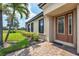 Inviting home exterior with manicured landscaping, brick walkway and a charming front door at 5863 Cavano Dr, Sarasota, FL 34231