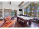 The game room offers a relaxing space to enjoy a game of pool or sit and enjoy the scenery at 5863 Cavano Dr, Sarasota, FL 34231