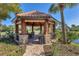 The outdoor gazebo provides a place to sit and relax and enjoy the surrounding nature at 5863 Cavano Dr, Sarasota, FL 34231