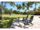 Outdoor lounge area featuring Adirondack chairs and a volleyball court for residents to enjoy at 5863 Cavano Dr, Sarasota, FL 34231