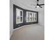 Empty main bedroom featuring a ceiling fan, and natural light from two windows at 5863 Cavano Dr, Sarasota, FL 34231