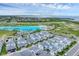 Breathtaking aerial shot showcasing the Aqua community, its lagoon, and surrounding landscape at 6028 Red Mangrove Ln, Bradenton, FL 34210