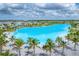 Spacious blue lagoon is surrounded by palm trees and sandy beaches, offering a tropical paradise for residents at 6028 Red Mangrove Ln, Bradenton, FL 34210