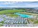 Expansive aerial view of the Aqua community with a lagoon, green space, and white-exterior homes at 6028 Red Mangrove Ln, Bradenton, FL 34210