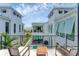Balcony view of a modern home featuring an outdoor pool and a private courtyard at 6028 Red Mangrove Ln, Bradenton, FL 34210