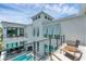 Balcony view of a modern home featuring an outdoor pool and a private courtyard at 6028 Red Mangrove Ln, Bradenton, FL 34210