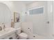 Bathroom featuring a modern sink, toilet, and glass-enclosed shower at 6028 Red Mangrove Ln, Bradenton, FL 34210