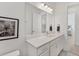 This bathroom boasts a bright vanity with an oversized mirror and storage at 6028 Red Mangrove Ln, Bradenton, FL 34210