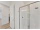 This bathroom features a glass enclosed shower and a neutral color palette at 6028 Red Mangrove Ln, Bradenton, FL 34210