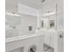 Modern bathroom featuring dual sinks, large mirror, and glass enclosed shower at 6028 Red Mangrove Ln, Bradenton, FL 34210