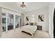 Bedroom with a view of the outdoor pool area and modern decor at 6028 Red Mangrove Ln, Bradenton, FL 34210